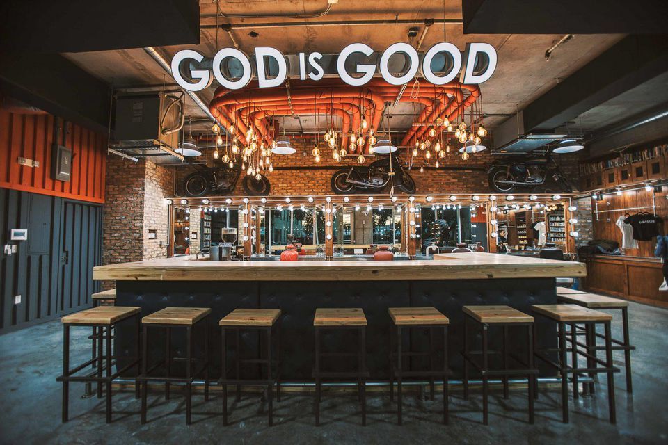 God is Good on the wall at The Spot Barbershop